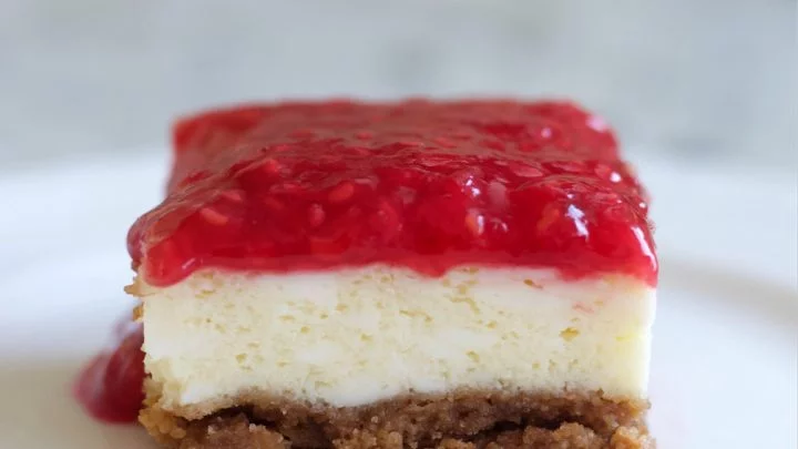 Raspberry Cheesecake Square Cut On A Plate.