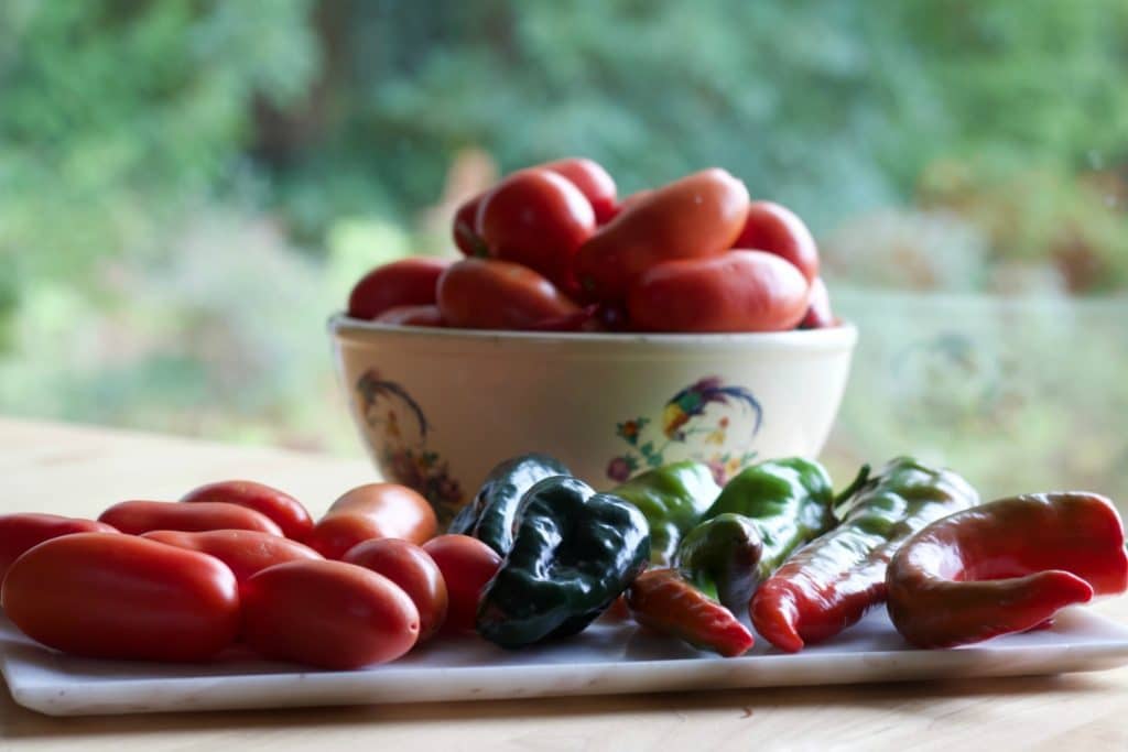 Garden Harvested Roma Tomatoes And Peppers