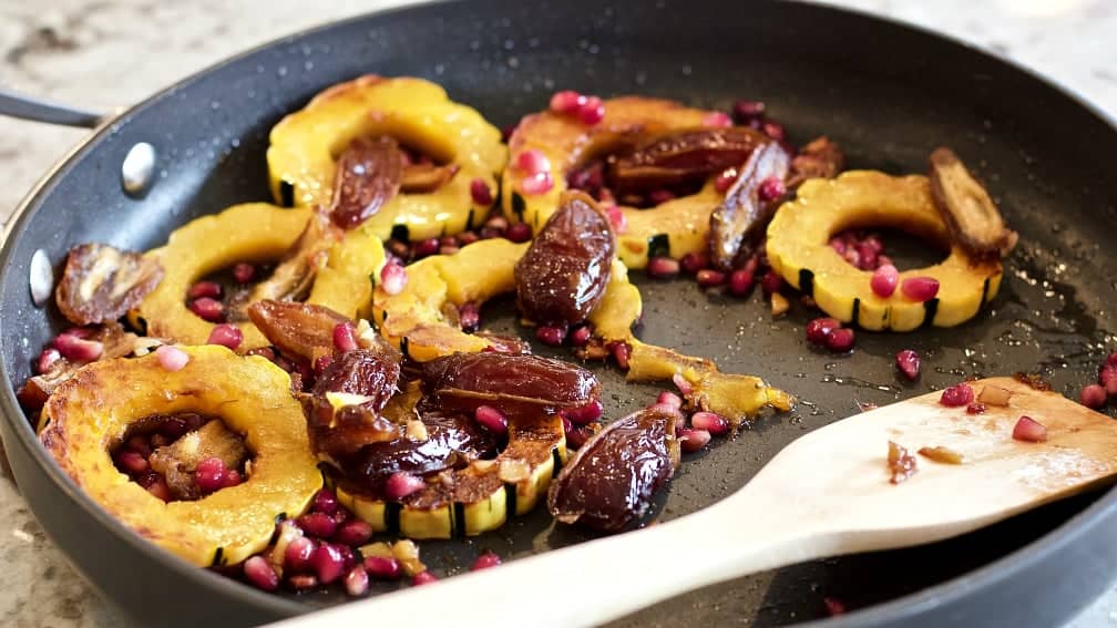 Delicata Squash Saute' At Serving In A Skillet With A Wooden Server.