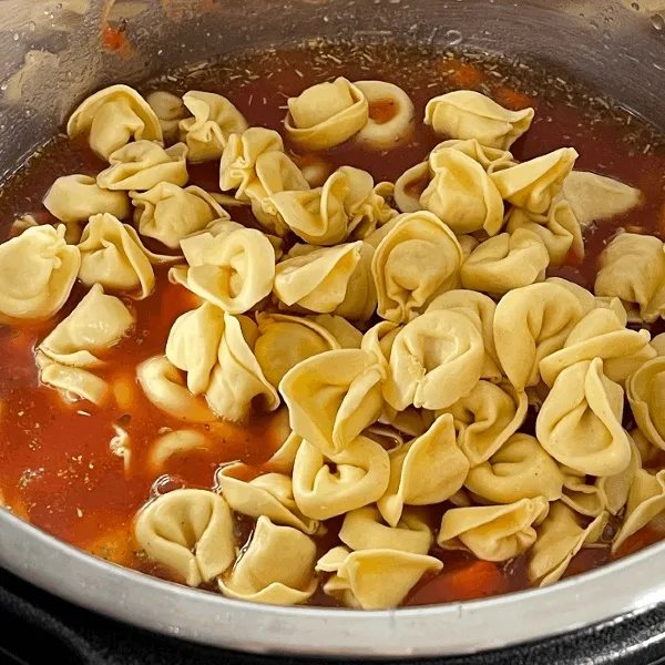 Adding Tortellini To Tortellini Sausage Soup