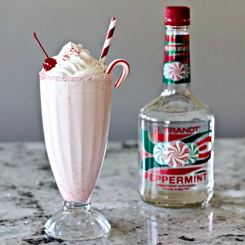 Peppermint Milkshake With A Schnapps Liqueur Bottle