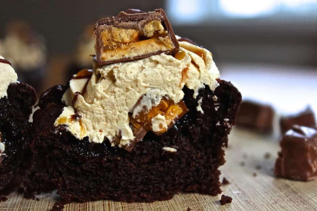 Chocolate Cupcake With Peanut Butter Frosting And Filled With Snickers And Salted Caramel Sauce