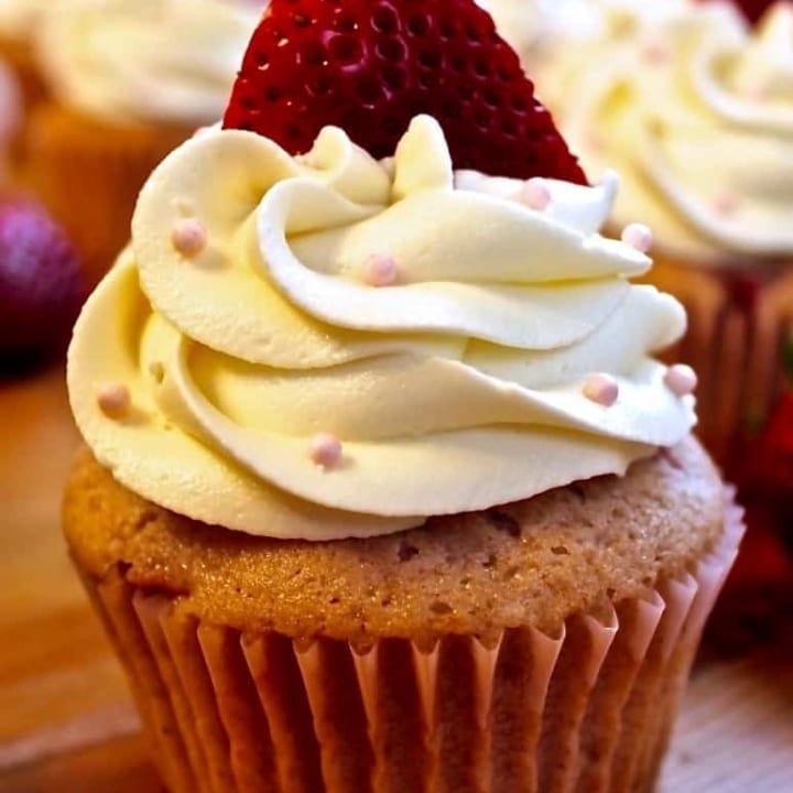Fresh Strawberry Cupcakes with fresh strawberries baked right in! By http://homemadeFoodJunkie.com