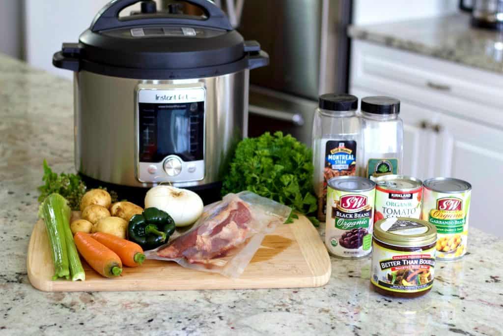 Igredients for venison stew sitting on the counter with the instant pot