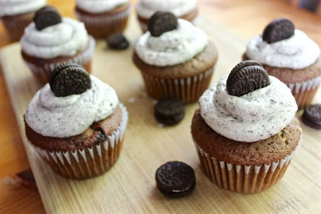 Cookies And Cream Cupcakes With Mini Oreo Cookies Around Them