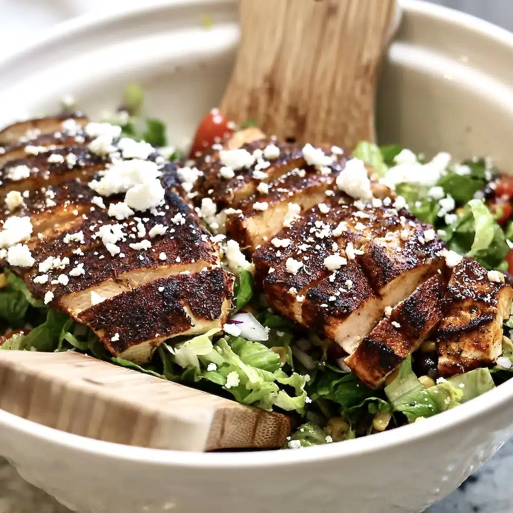Blackened Chicken Salad with Corn and Black Beans 1 blackened chicken on salad with cheese