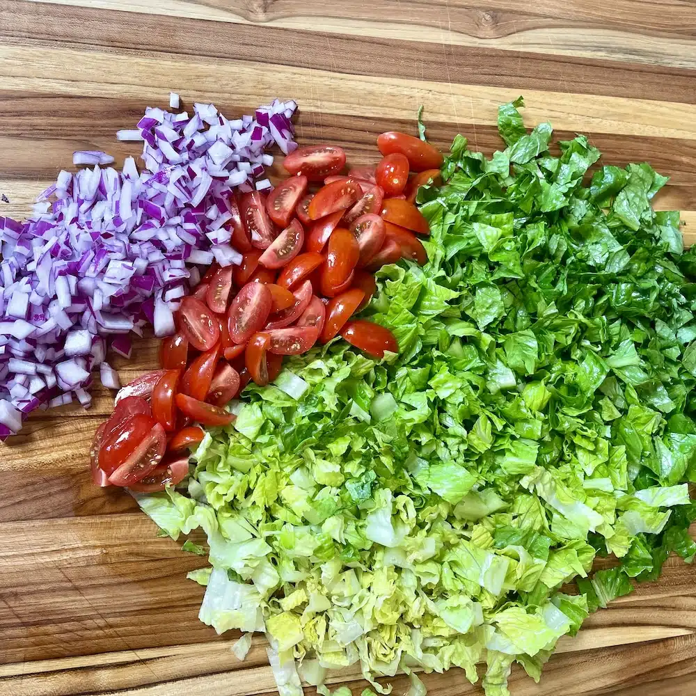 Blackened Chicken Salad with Corn and Black Beans 12 chopped lettuce, tomatoes and onions for blackened chicken salad