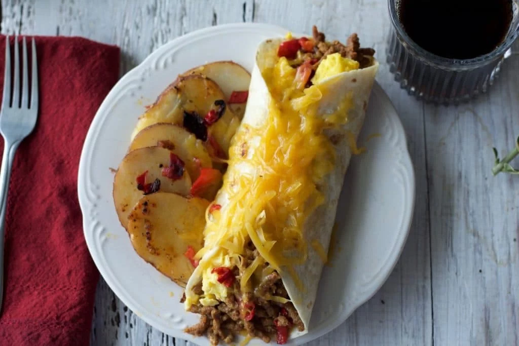 Breakfast Burrito A Messy, Flavorful, Delicious, South Of The Border, Breakfast Burrito That Satisfies Those Morning Munchies. Stuffed With Chorizo Sausage, Cheddar Cheese, Peppers And Scrambled Eggs. This Is A Filling, Low Carb, Low Sugar, Handful Of Nutrition! Http://Homemadefoodjunkie.com