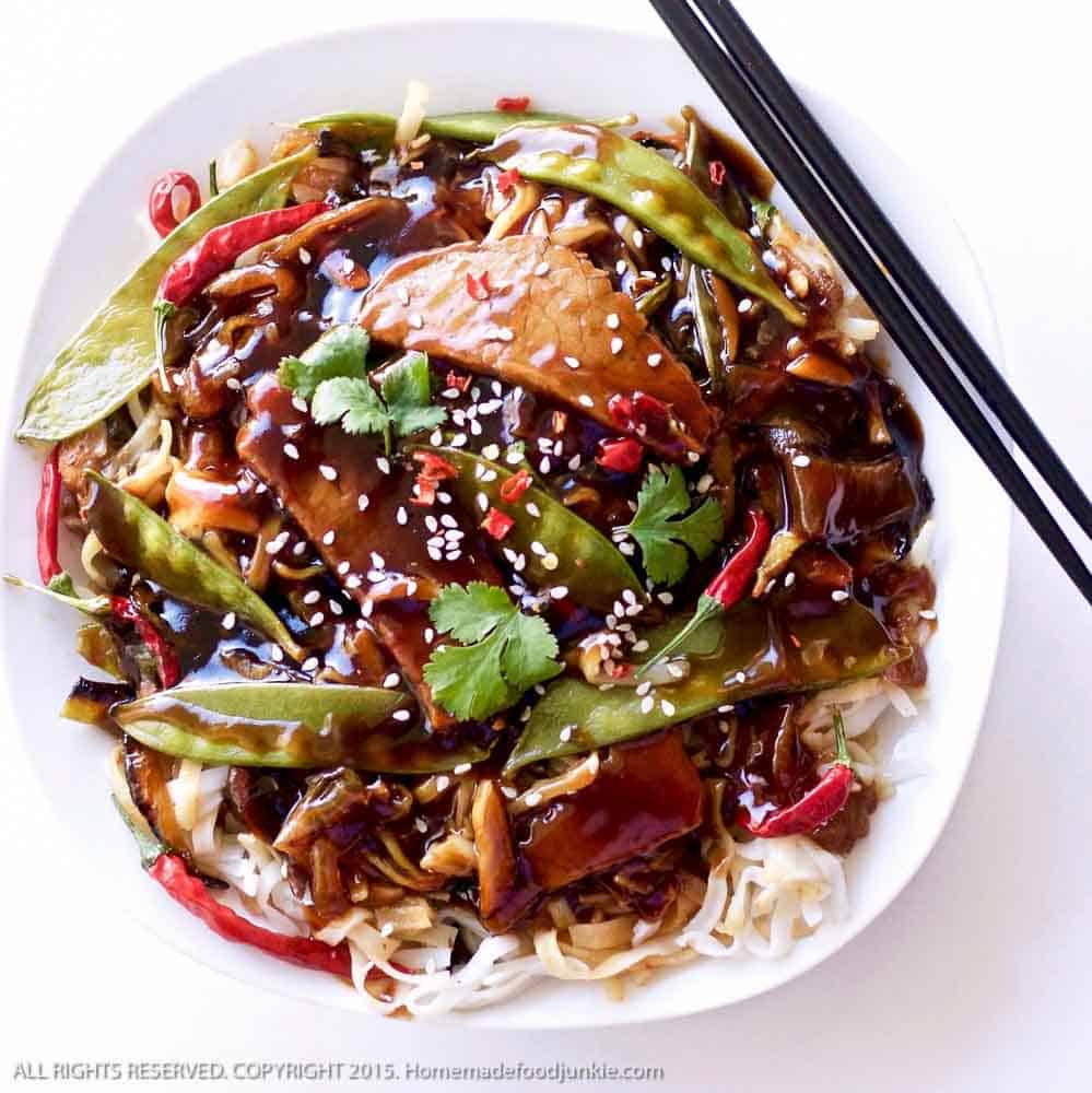 Sesame Beef Thai Noodle Dinner With Chopsticks On A Plate