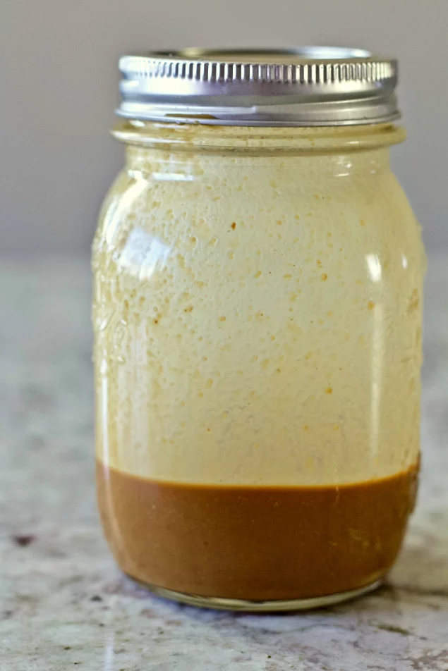 Creamy Balsamic Dressing In A Mason Jar With A Lid.