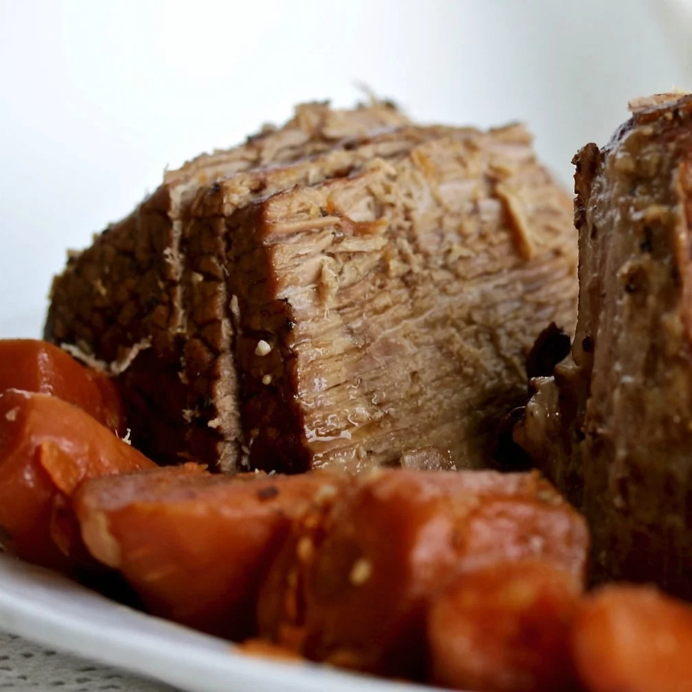 Instant Pot Roast Beef Sliced On A Platter With Vegetables