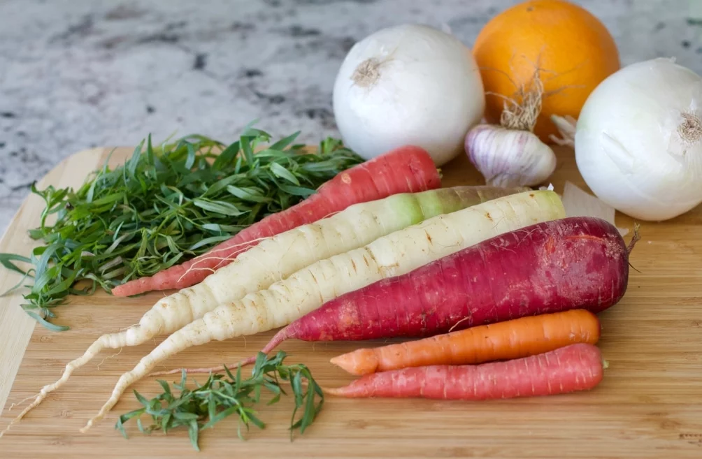 Ingredients For Carrot Tarragon Soup. Rainbow Carrots, White Onions, Fresh Garlic, Fresh Tarragon And Fresh Oranges
