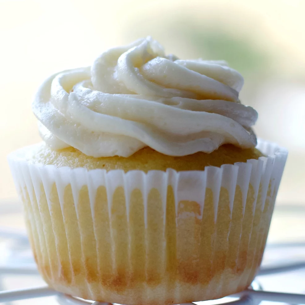 Super Moist Vanilla Cupcakes Recipe 1 Vanilla Cupcake With Buttercream Frosting In A White Wrapper