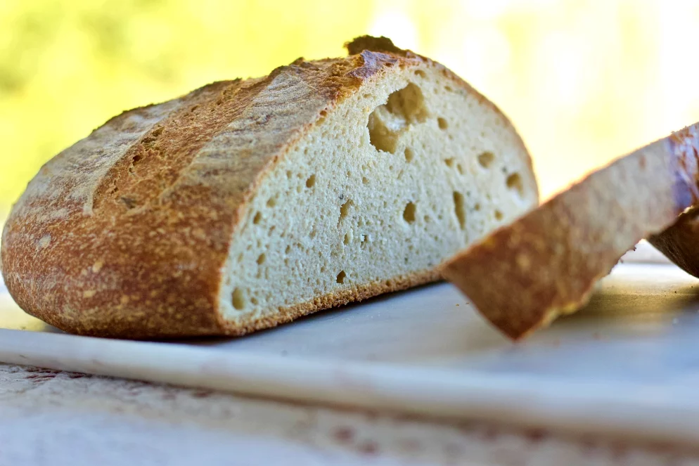 Roasted Garlic Rosemary Sourdough Cut On A Plate