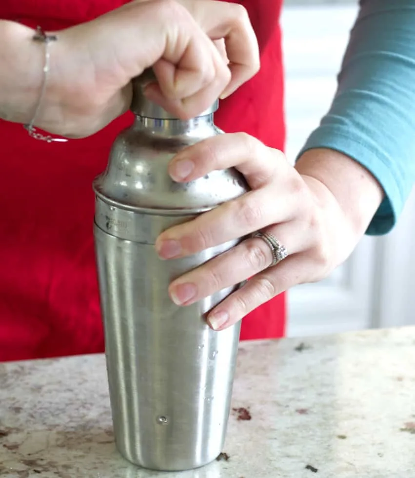 A Cold Shaker With The Vodka/Lemon Mixed