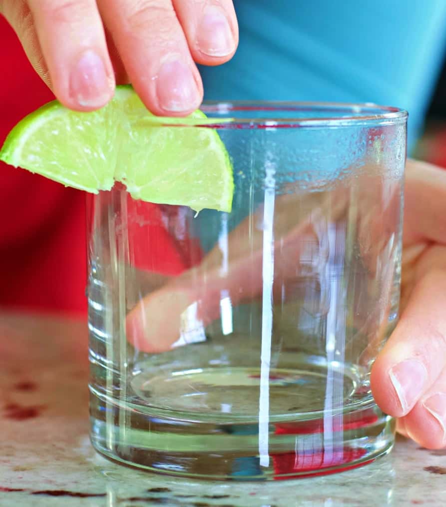 Tequila Sunrise Margarita On The Rocks 3 Liming The Rim Of A Glass