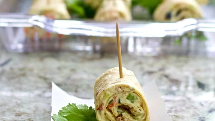 Single Cream Cheese Bite With Loaded Tray Behind