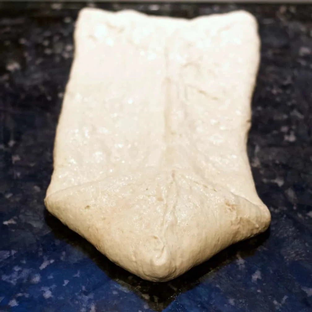 Fold Front Points-Forming Dough For Bread Pan.