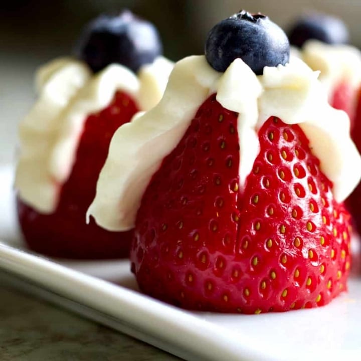 strawberry filled with sweet cream cheese and a blueberry topper.