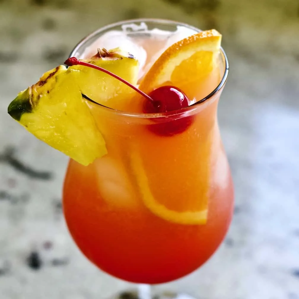Mai Tai Recipes-Coconut Rum And Trader Vics 2 Mai Tai In The Fruity Mixed Drink Form. Garnished With A Pineapple Wedge. Half Orange Slice And Maraschino Cherry