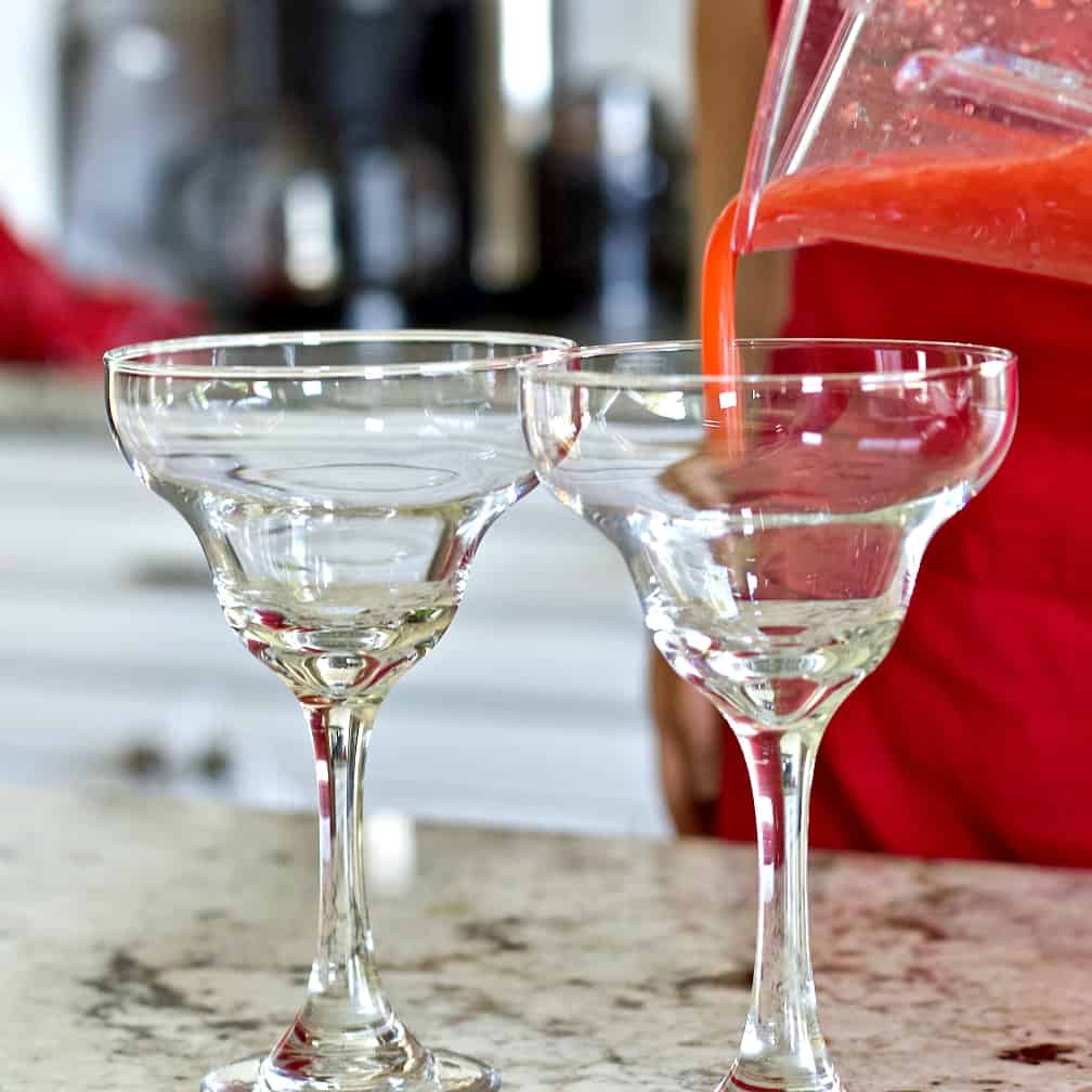 Pouring A Strawberry Daiquiri Into A Margarita Glass.