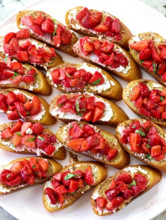 a tray full of strawberry basil bruschetta