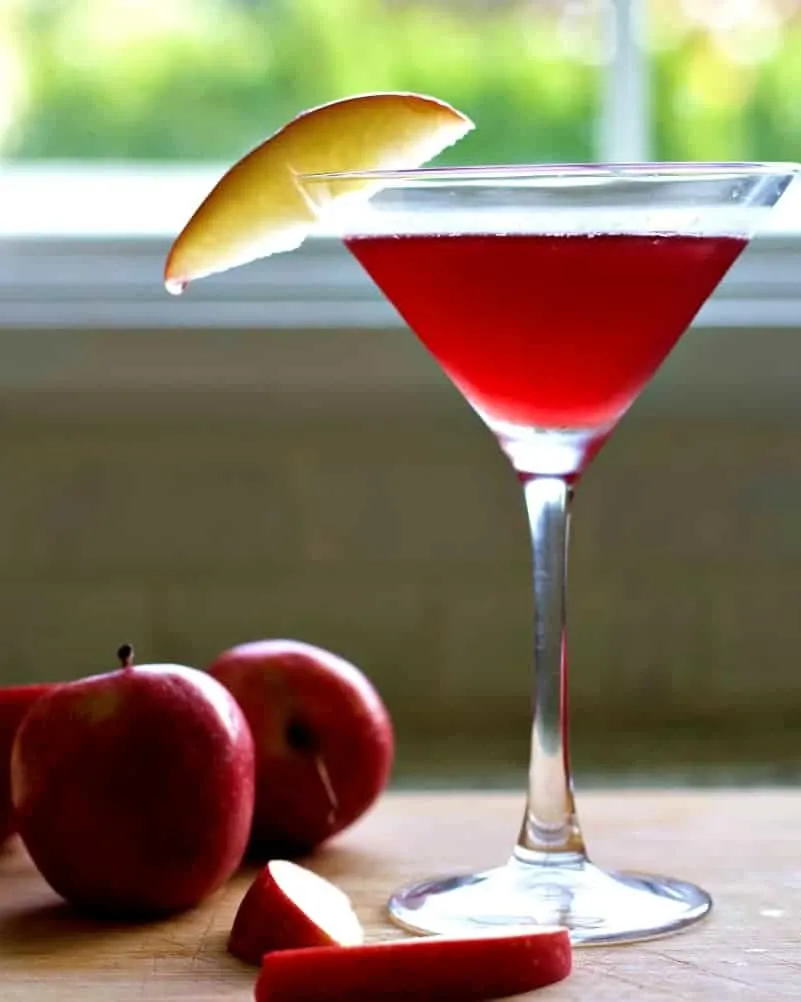Garnished Washington Apple Drink With Apples On A Wooden Board.