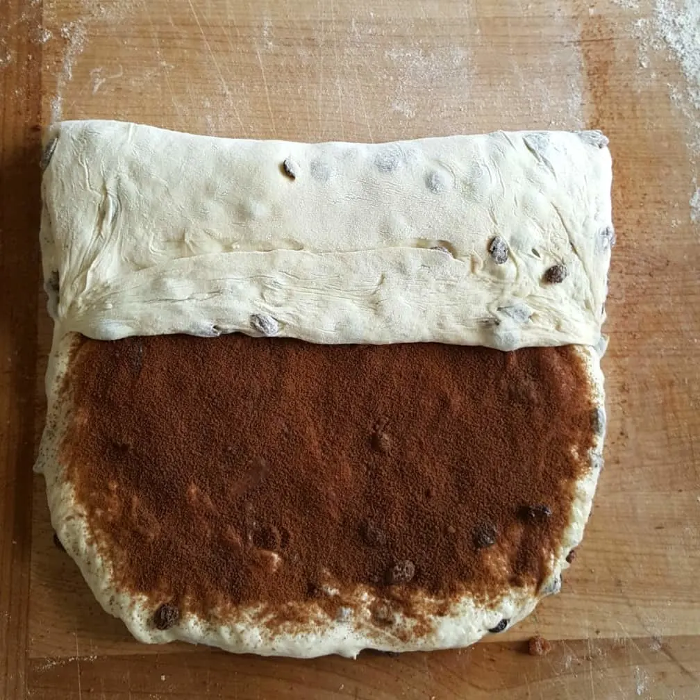 Preparing To Roll The Filing Up. Cinnamon Raisin Bread