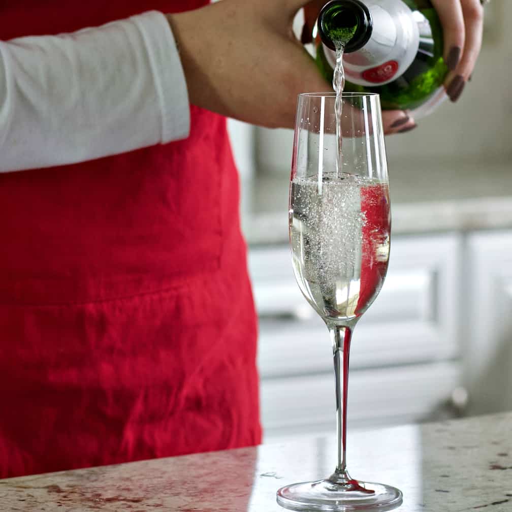 Pouring Sparkling Wine Into A Champagne Flute