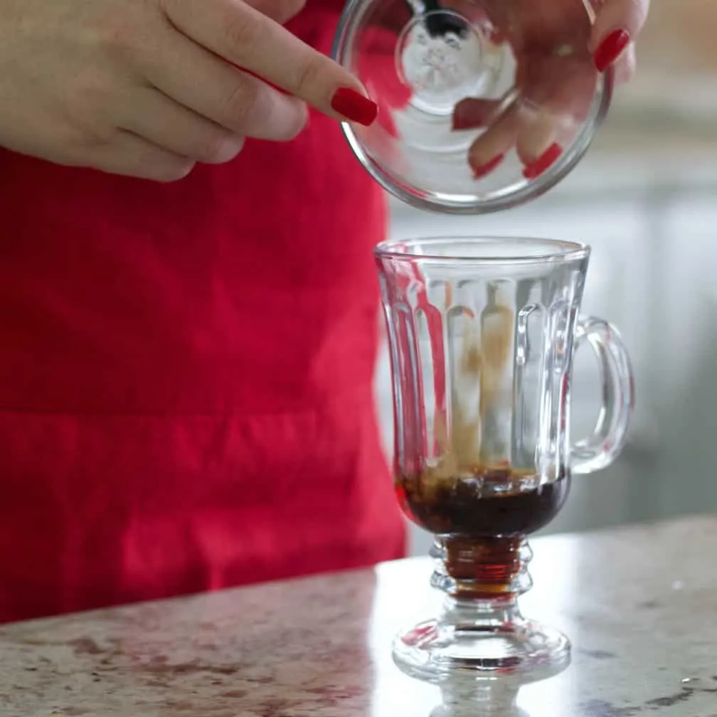 Pouring Brown Sugar Into Mug-Mexican Coffee