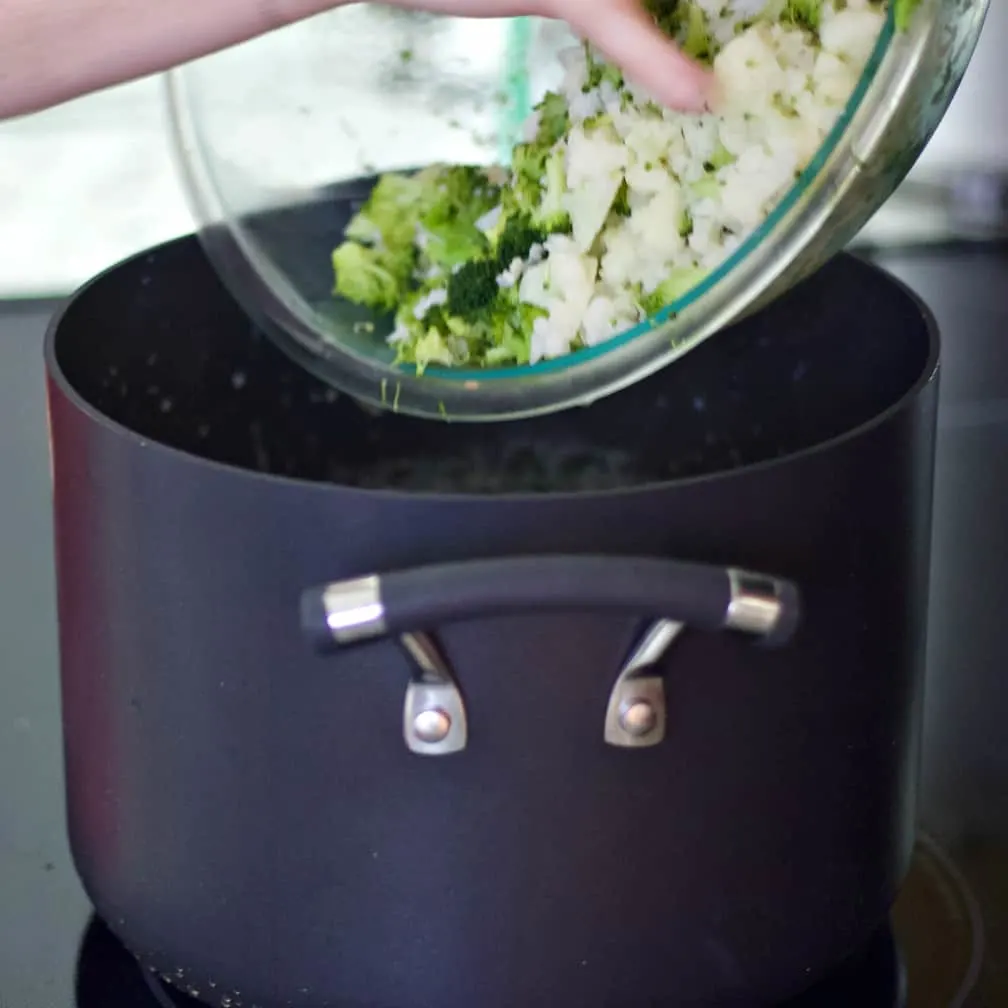 Pouring In Steamed Vegetables