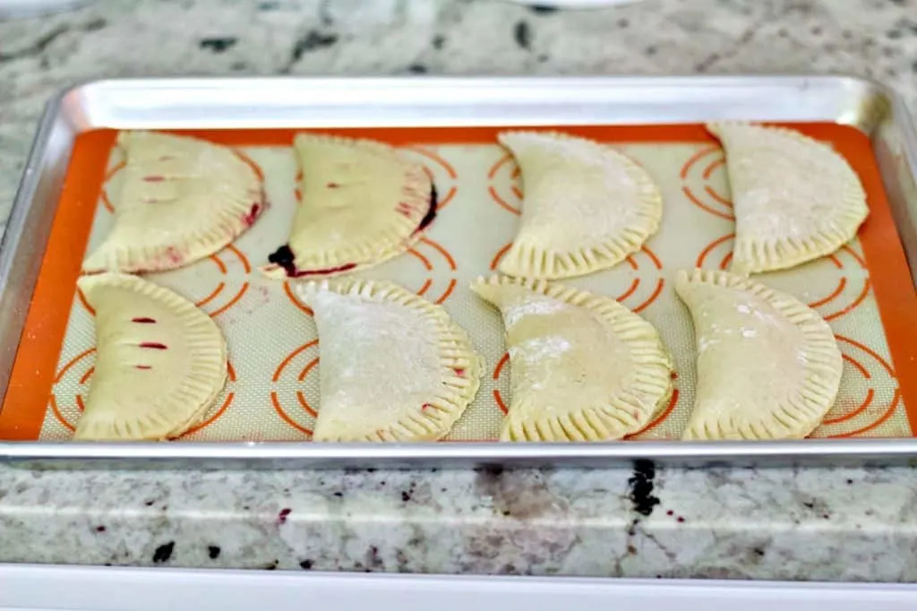 Unbaked Hand Pies On Baking Sheet.