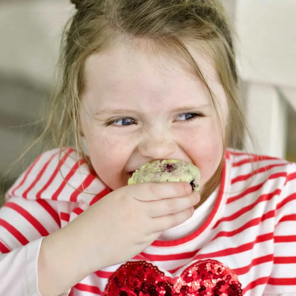 Child Eating Lemon Blueberry Muffins