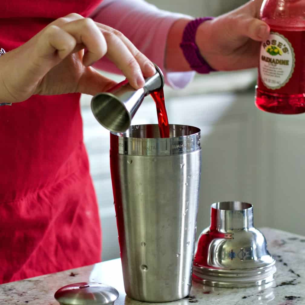 Pouring Grenadine Into Shaker.