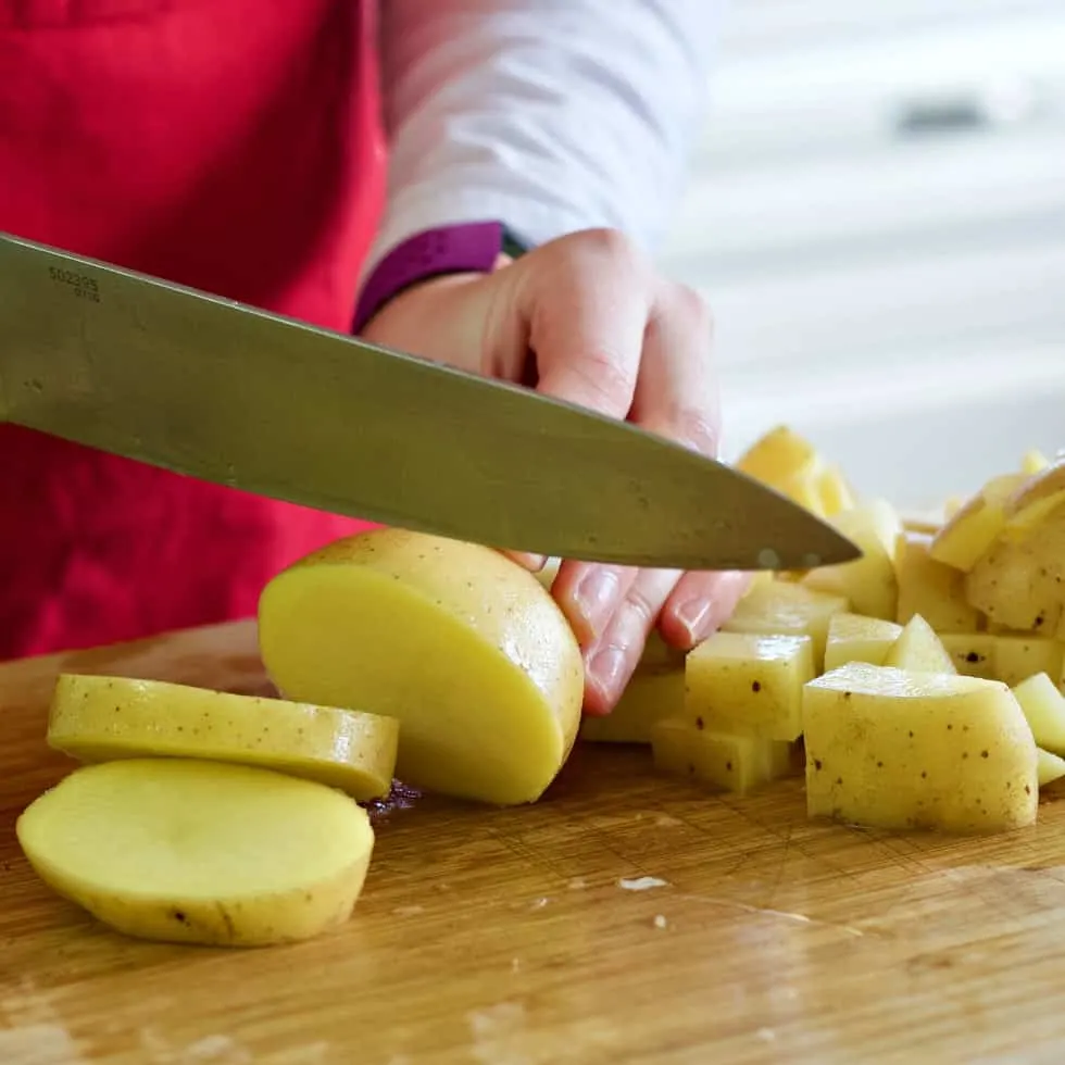 Chopping Yukon Gold Potato-Rotisserie Chicken Soup