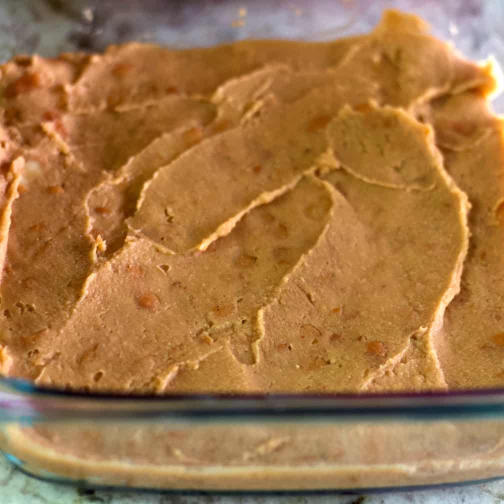 Refried Beans In A Layer In Baking Dish.