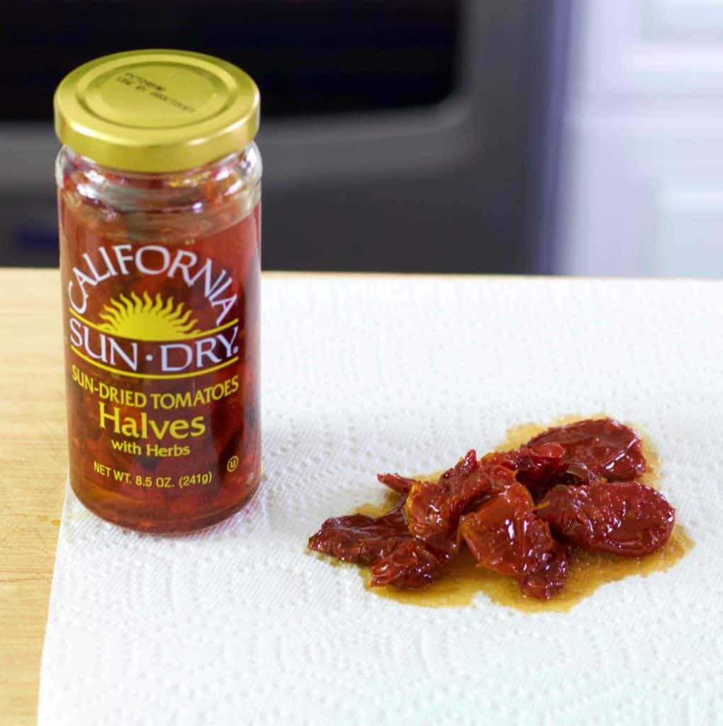 Sun Dried Tomatoes And Jar On A Paper Towel