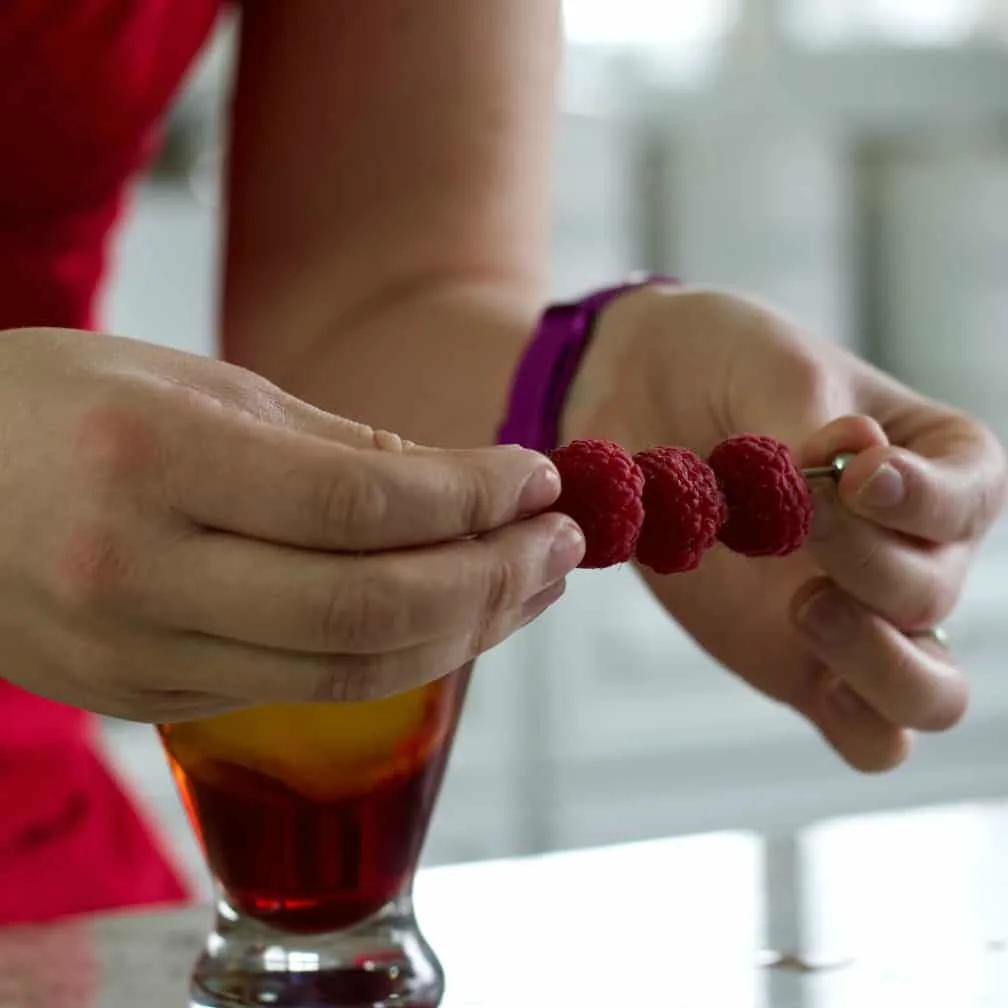 Three Fresh Raspberries On A Pick