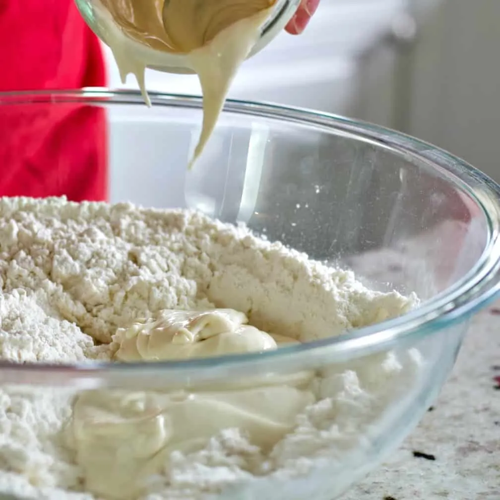 Autolyse vs Fermentolyse vs Saltolyse: Which Sourdough Mixing Method Should You Use? 4 Pouring starter into bowl-pretzels
