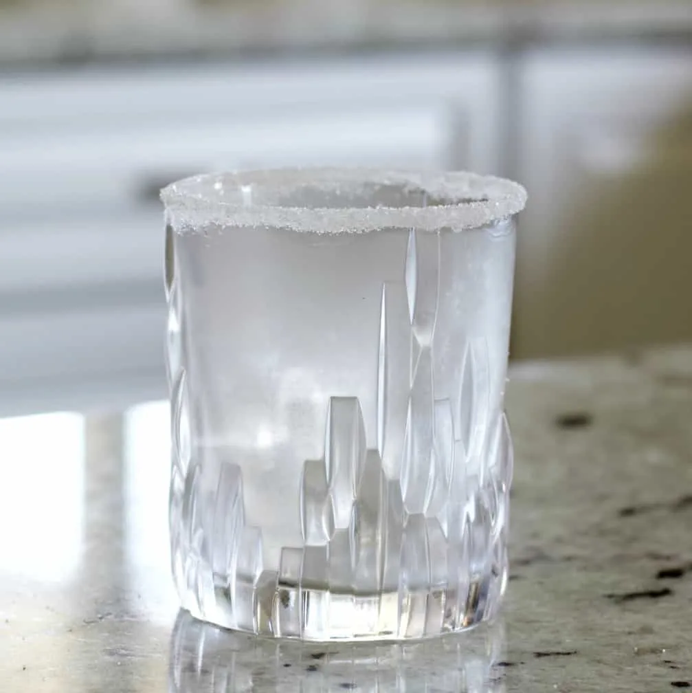Rimmed And Chilled Glass With Ice.