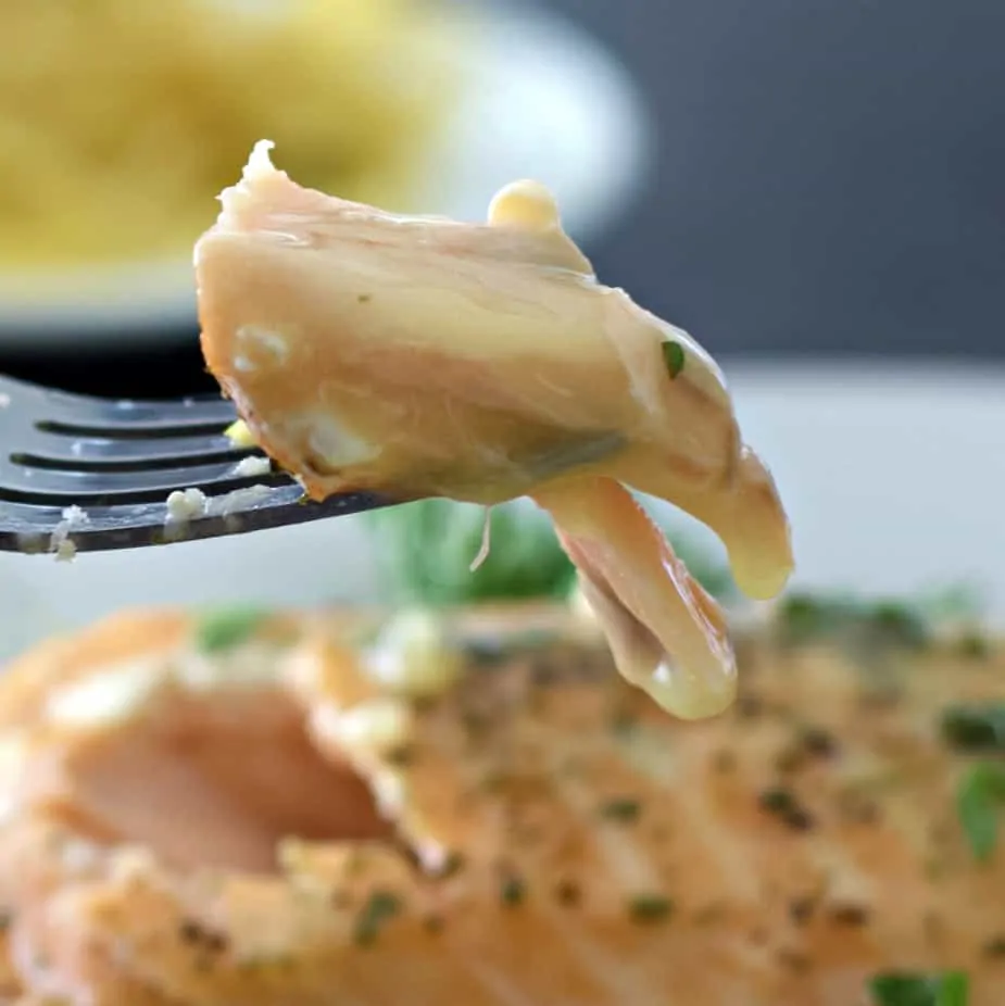 Lemon Butter Sauce On Salmon. One Bite On A Fork.