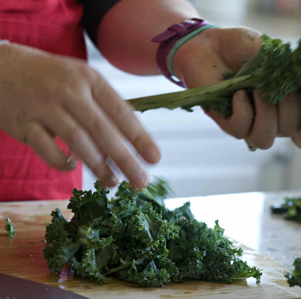 Stripping Kale From The Stalk.