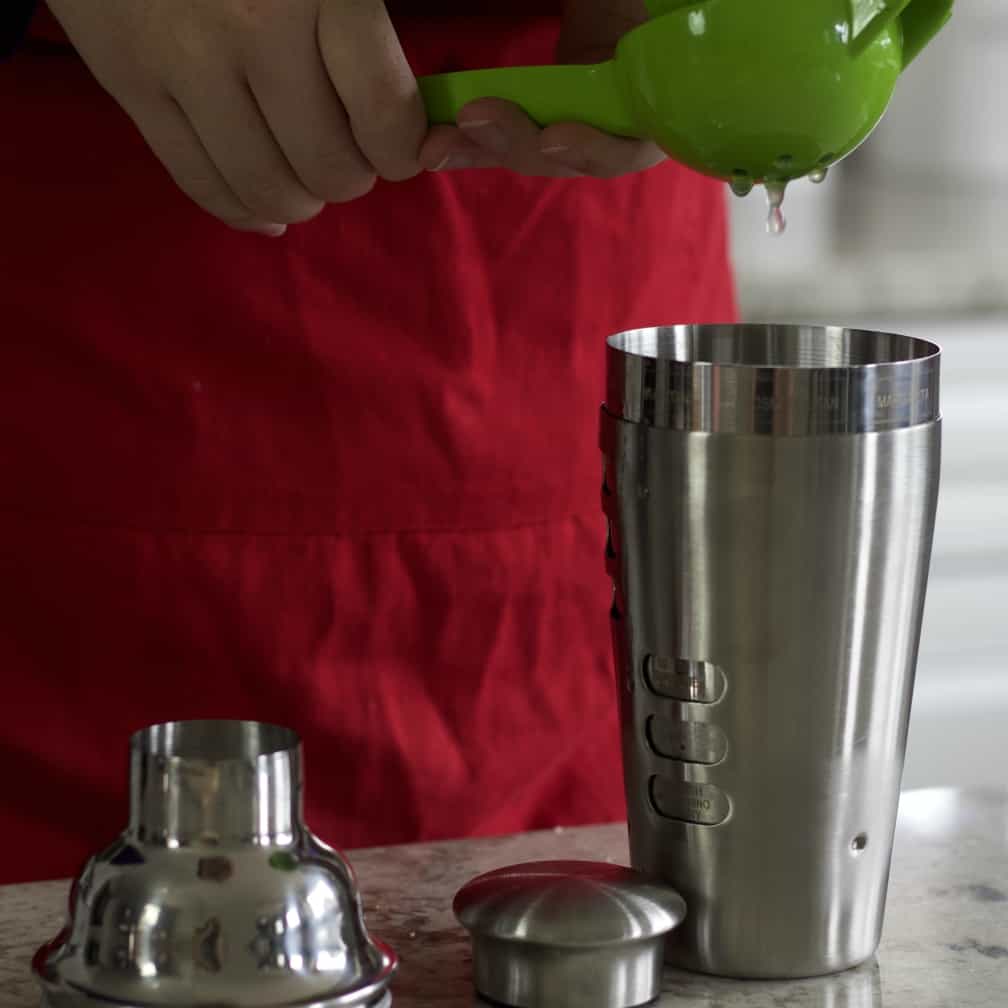 Squeezing A Lime Into Shaker