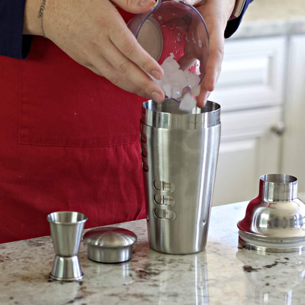 Pouring Ice Into Cocktail Shaker
