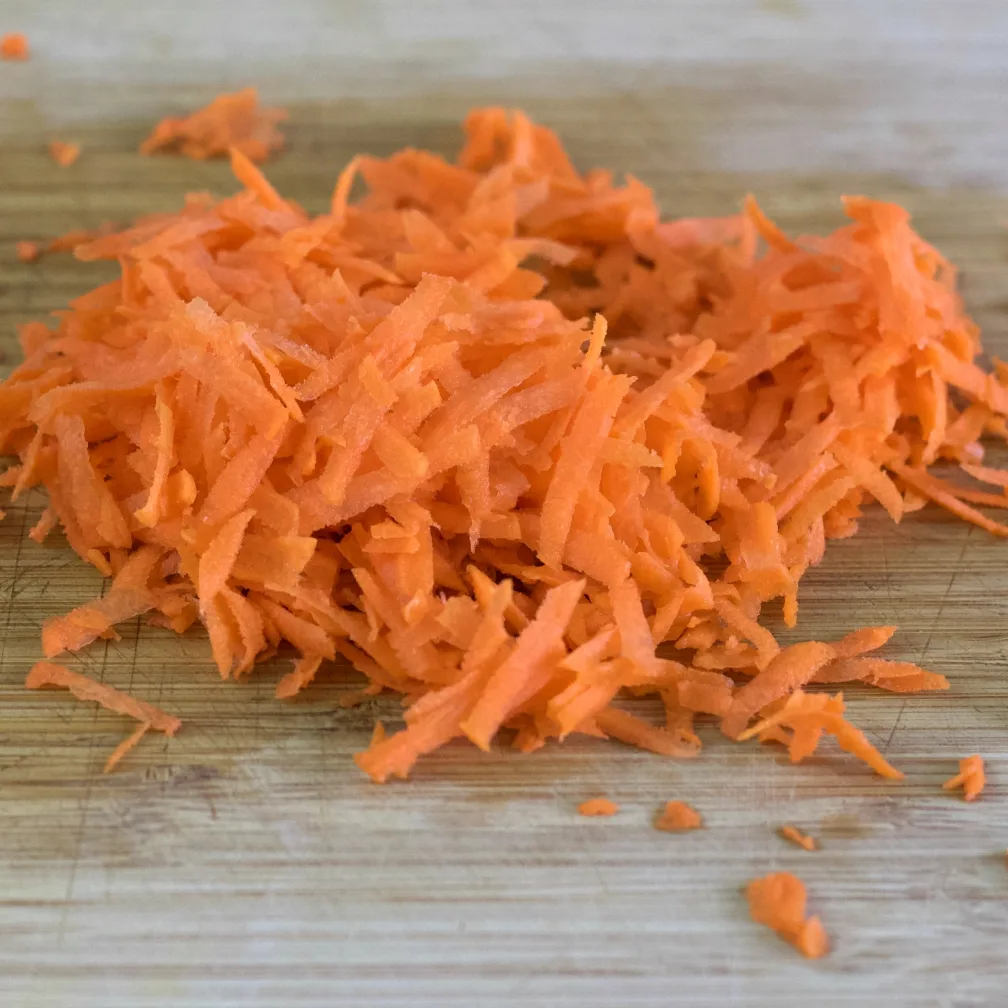 Egg Roll In A Bowl Keto Recipe 5 Grated Carrots On A Wooden Board