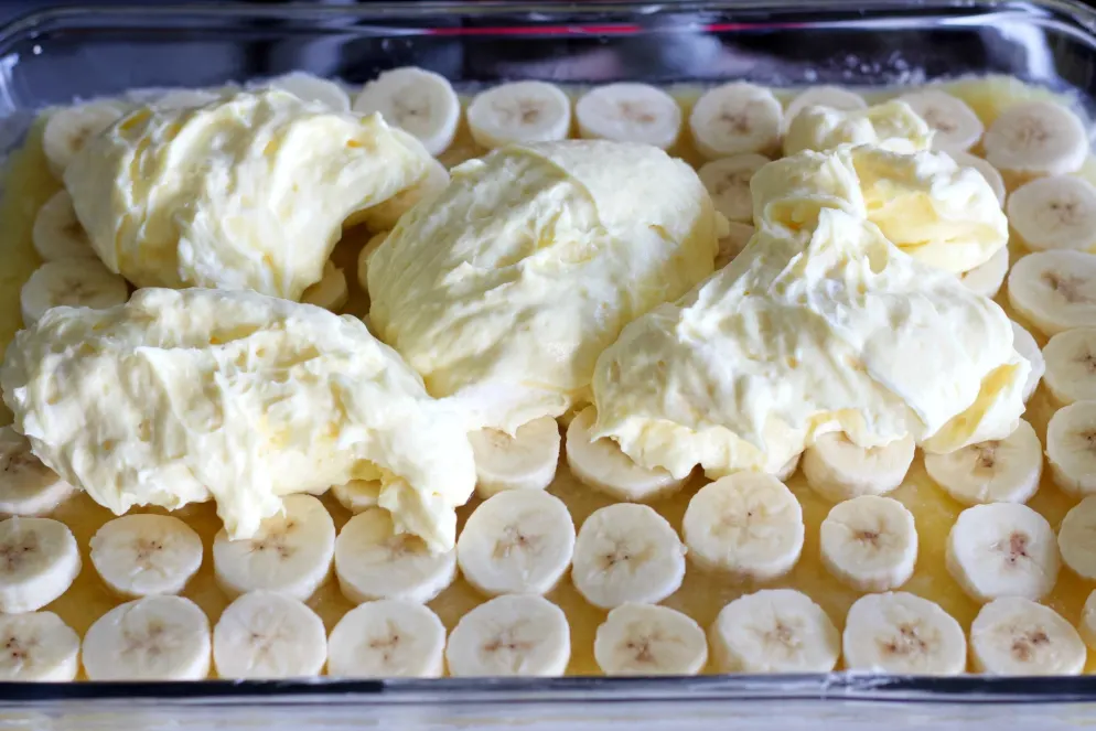 Spreading On Pudding Over Sliced Bananas