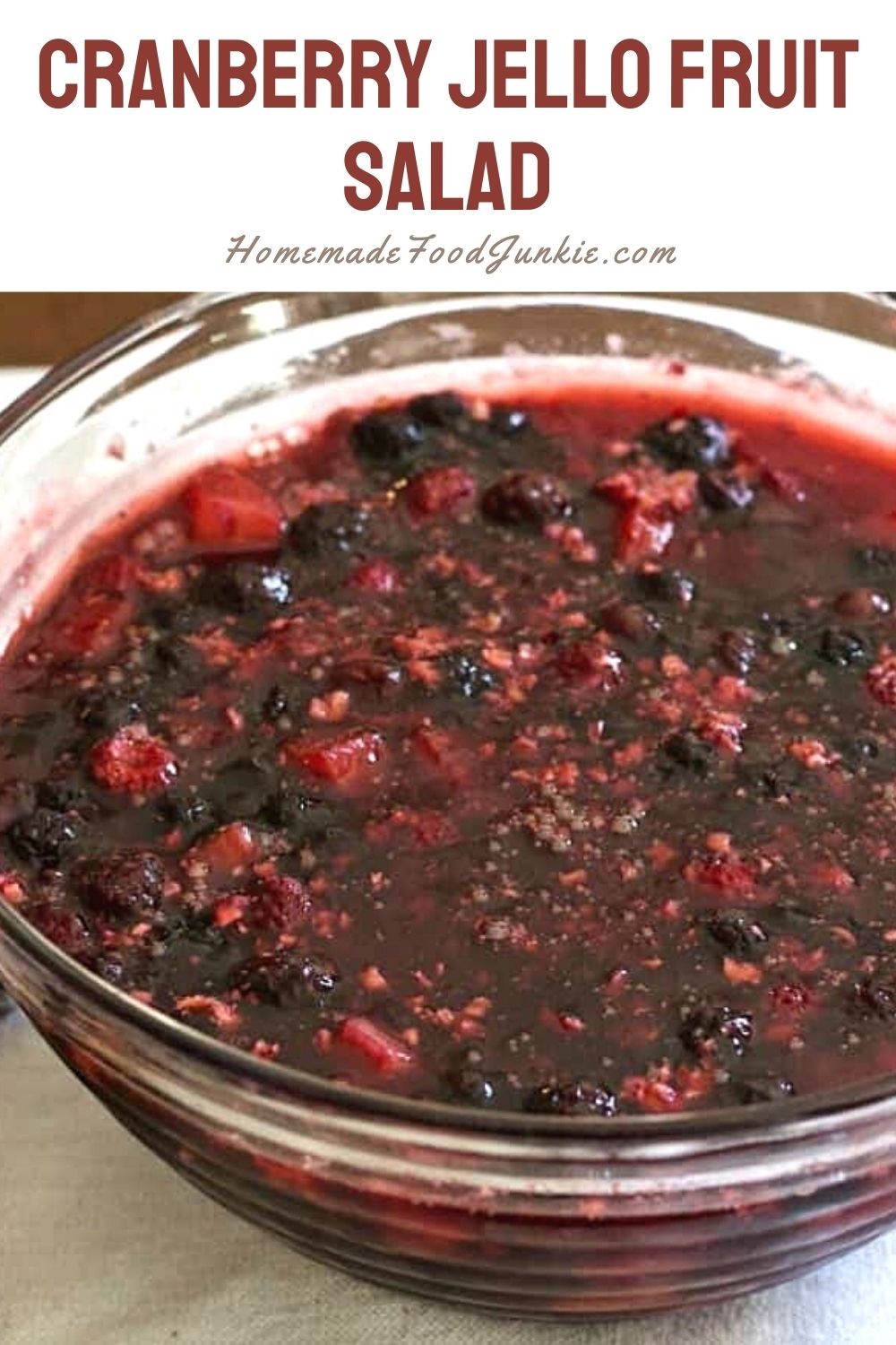 Cranberry Pineapple Berry Jello Salad Makes A Perfect Holiday Side Dish. Bright, Festive, And Absolutely Delicious! This Jello Salad Is Full Of Cranberries, Whole Blackberries, Pineapple Chunks And Nuts. #Jellosalad #Cranberryrecipe #Thanksgivingmenu #Thanksgivingsidedish #Christmasmenu #Holidayrecipe Cranberry Jello Fruit Salad-Pin Image