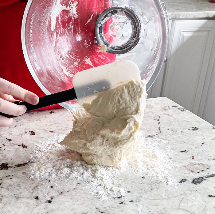 Scooping Flatbread Dough Onto Floured Board