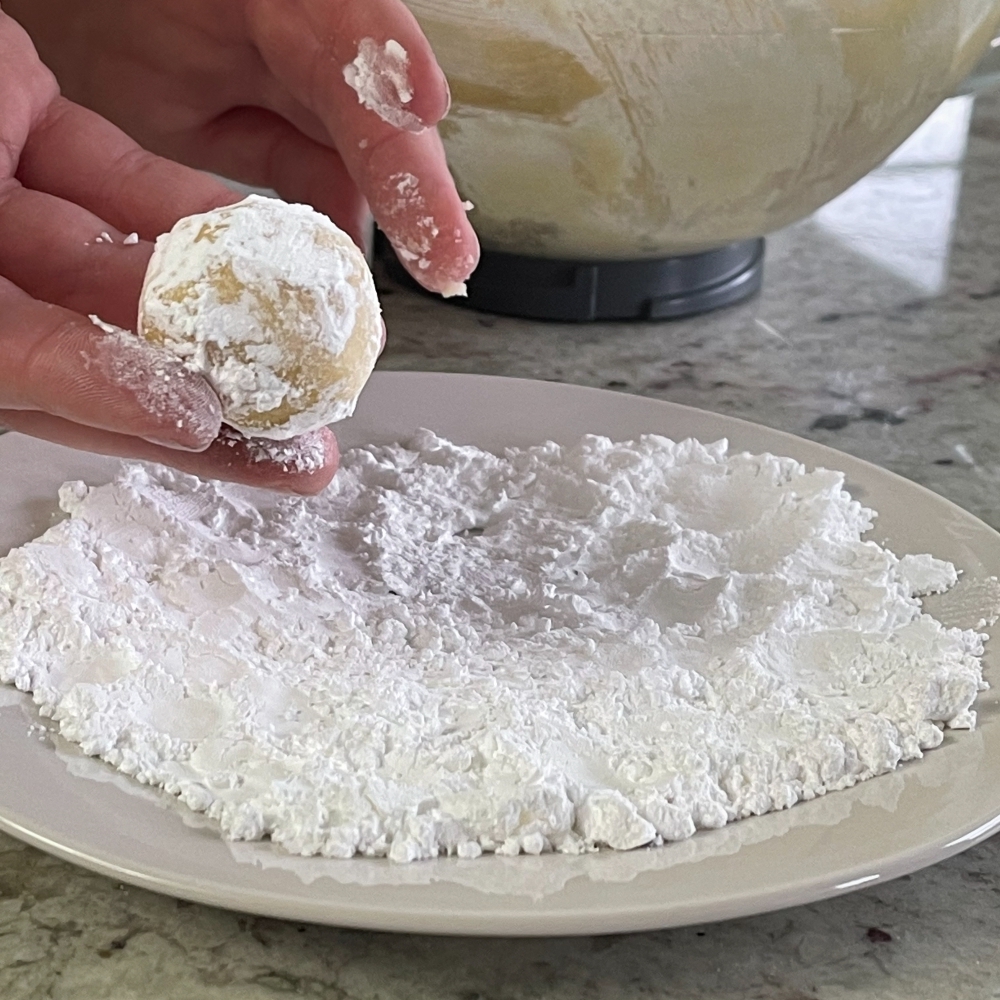 Lemon Cookie Dough Rolled In Powdered Sugar