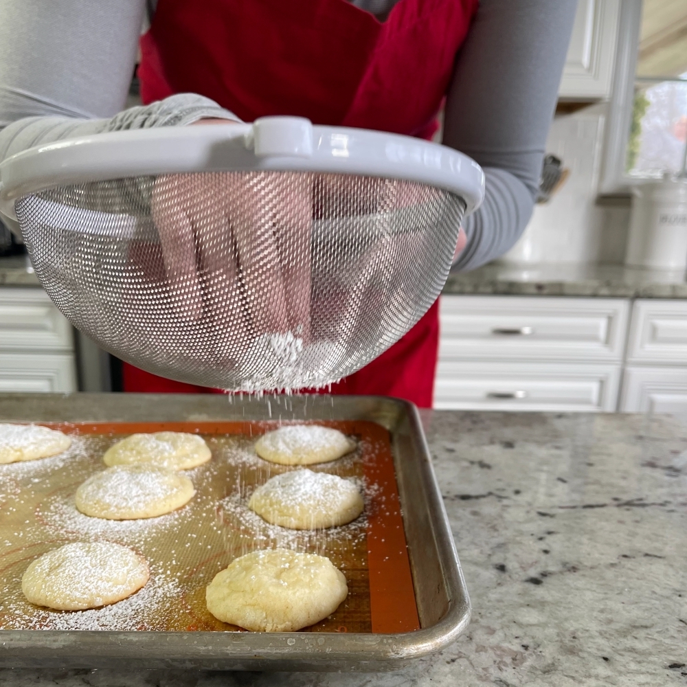 Sifting Powdered Sugar On Lemon Cookies